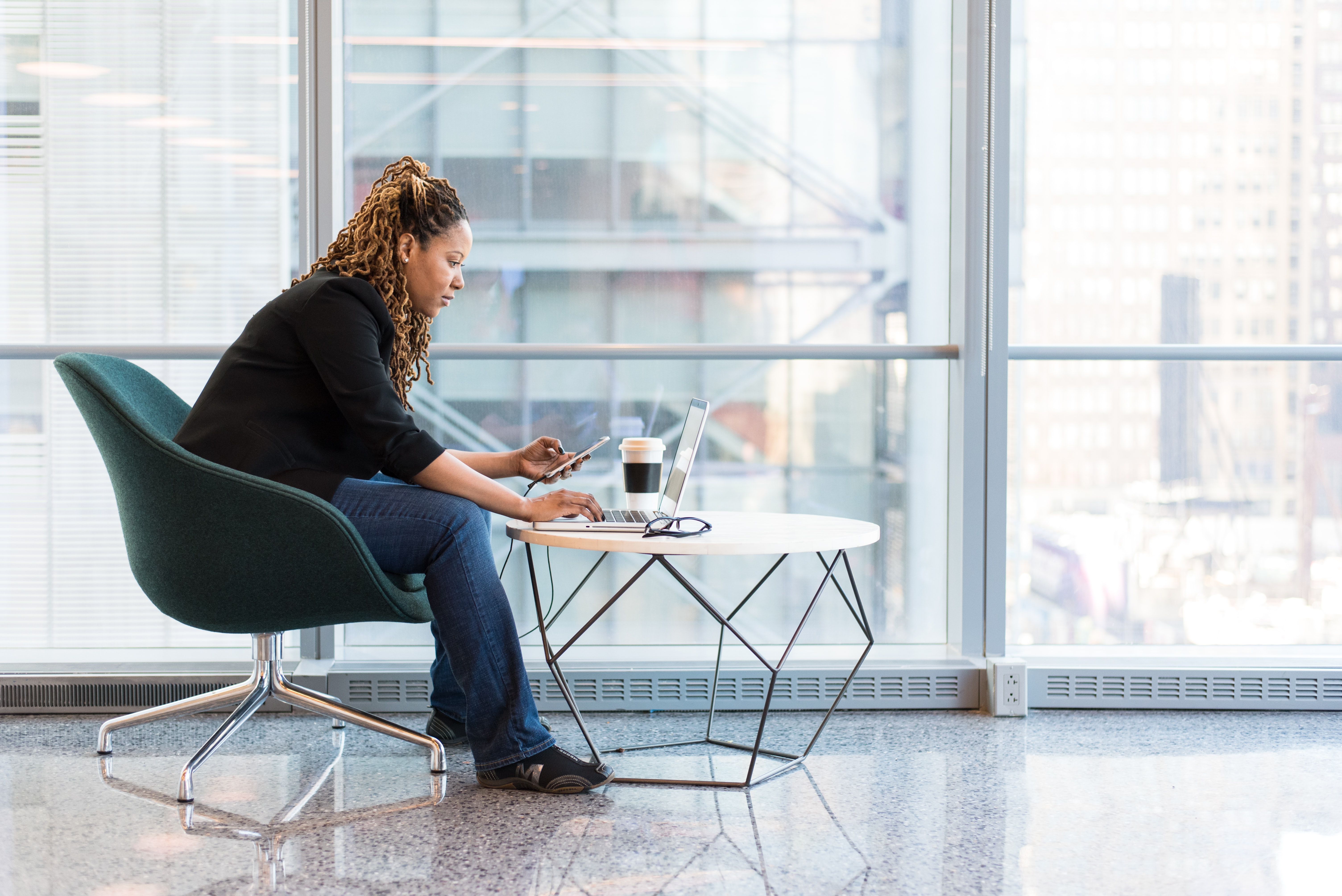 Image of a person sitting in a chair with good posture.