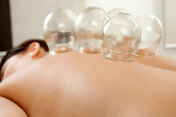 Oil, Cupping and Herbal Ball Compress Massage